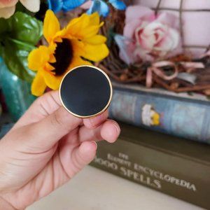 Vintage 80s Monet large black circle clip on earrings with gold tone rim!